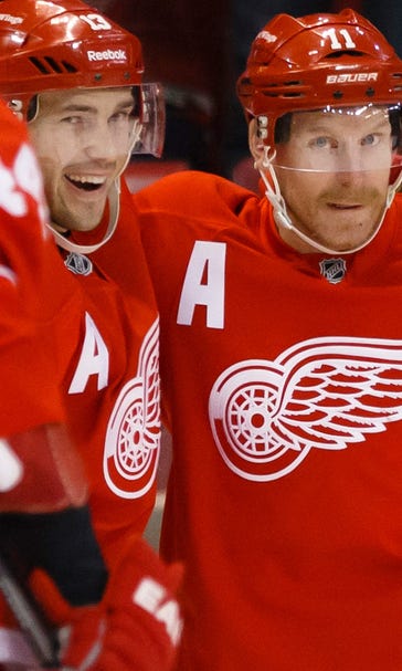 Wings edge Flames in OT